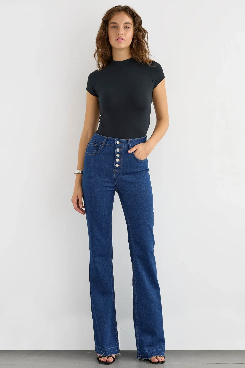 High-Waist Flare Jeans with Button Detail