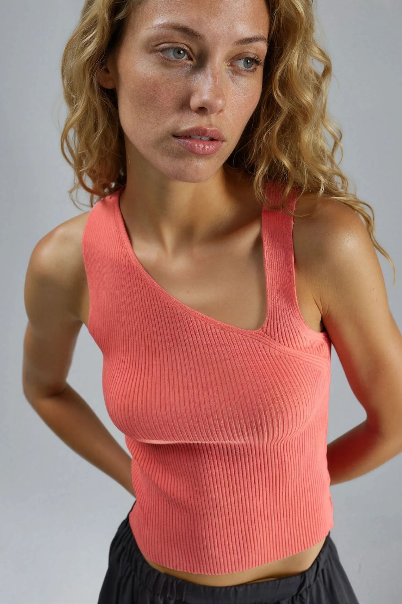 Fitted Asymmetrical Neck Ribbed Sleeveless Knit Top 1